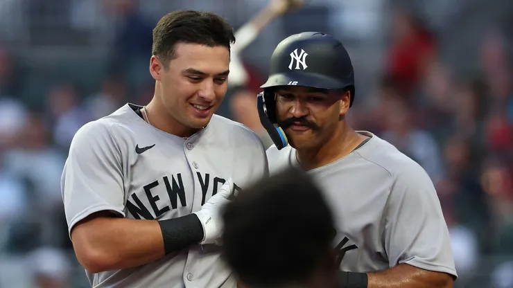 Anthony Volpe #11 of the New York Yankees reacts with Trent Grisham #12 after hitting a two-run homer in the fifth inning against the Atlanta Braves at Truist Park on July 19, 2025 in Atlanta, Georgia.