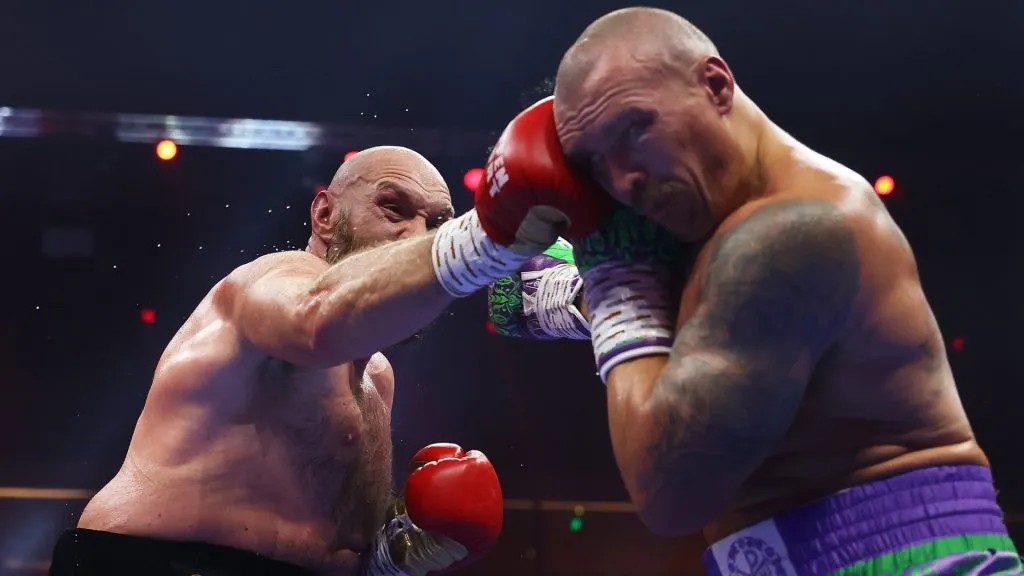 Tyson Fury and Oleksandr Usyk exchange punches during the IBF, IBO, WBA, WBC and WBO Undisputed World Heavyweight titles’ fight between Oleksandr Usyk and Tyson Fury as part of Oleksandr Usyk v Tyson Fury 2, Reignited card at Kingdom Arena on December 21, 2024 in Riyadh, Saudi Arabia. (Photo by Richard Pelham/Getty Images)