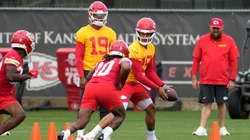 Patrick Mahomes #15 of the Kansas City Chiefs hands the ball of to Isiah Pacheco #10 during drills at The University of Kansas Health System Training Complex on June 18, 2025.