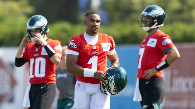 Jalen Hurts #1, Nick Mullens #10, and Joe Flacco #7 of the Philadelphia Eagles look on during training camp at the NovaCare Complex on July 28, 2021.