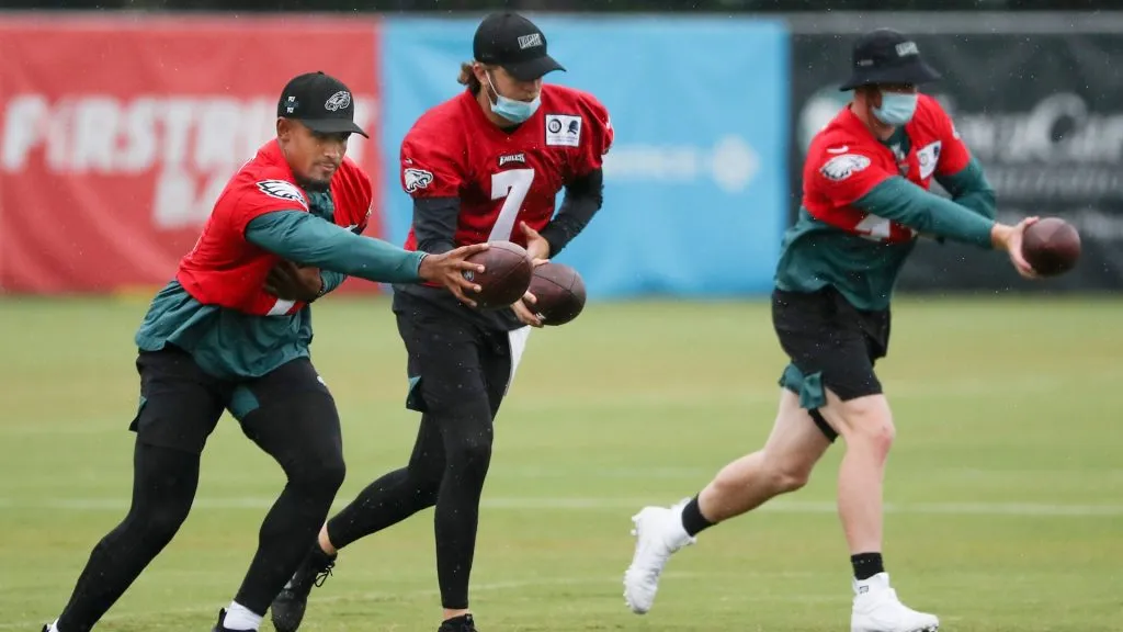 Jalen Hurts #2, Nate Sudfeld #7 and Carson Wentz #11 of the Philadelphia Eagles run drills during training camp at NovaCare Complex on August 19, 2020. (Source: Heather Khalifa-Pool/Getty Images)