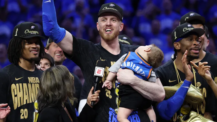 Isaiah Hartenstein #55 of the Oklahoma City Thunder celebrates with his son Elijah after defeating the Indiana Pacers 103-91 in Game Seven of the 2025 NBA Finals.