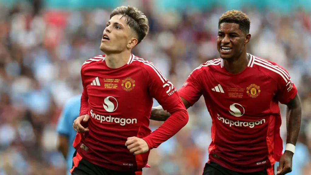 Alejandro Garnacho celebrates with Marcus Rashford after scoring a goal during the 2024 FA Community Shield match between Manchester United and Manchester City.