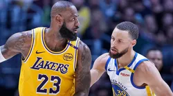 LeBron James #23 of the Los Angeles Lakers controls the ball against Stephen Curry #30 of the Golden State Warriors.
