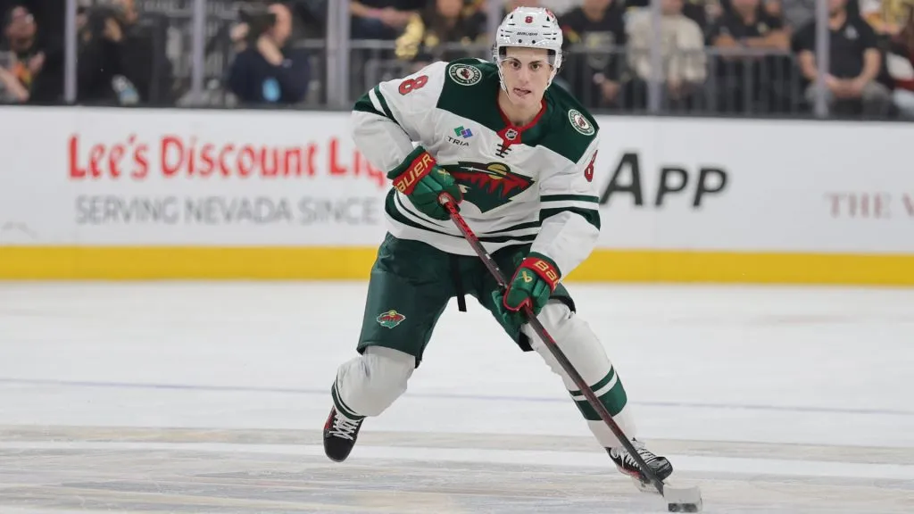 Zeev Buium #8 of the Minnesota Wild skates with the puck against the Vegas Golden Knights in the third period of Game Two of the First Round of the 2025 Stanley Cup Playoffs at T-Mobile Arena on April 22, 2025 in Las Vegas, Nevada. (Photo by Ethan Miller/Getty Images)