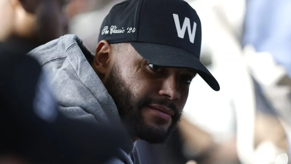 Dak Prescott #4 looks on from the audience as Brian Schottenheimer is introduced as the new head coach