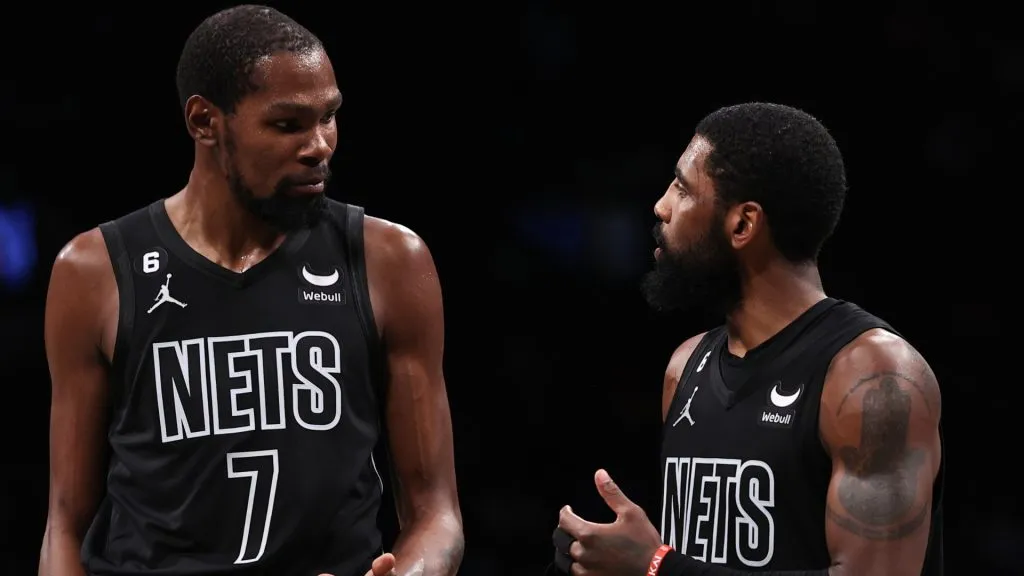Kyrie Irving #11 and Kevin Durant #7 of the Brooklyn Nets talk during a break in the action during the fourth quarter of the game against the Indiana Pacers.
