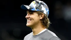 Justin Herbert #10 of the Los Angeles Chargers stands on the field prior to the start of an NFL preseason against the New Orleans Saints at Caesars Superdome on August 26, 2022 in New Orleans, Louisiana.