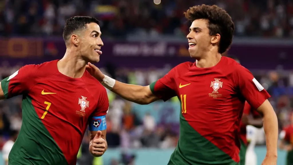 Cristiano Ronaldo of Portugal celebrates with Joao Felix after scoring their team’s first goal via a penalty during the FIFA World Cup Qatar 2022. (Clive Brunskill/Getty Images)