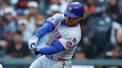 Juan Soto #22 of the New York Mets hits an RBI ground out in the top of the first inning against the San Francisco Giants.
