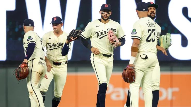 Minnesota Twins players celebrate their teams win against the Washington Nationals.
