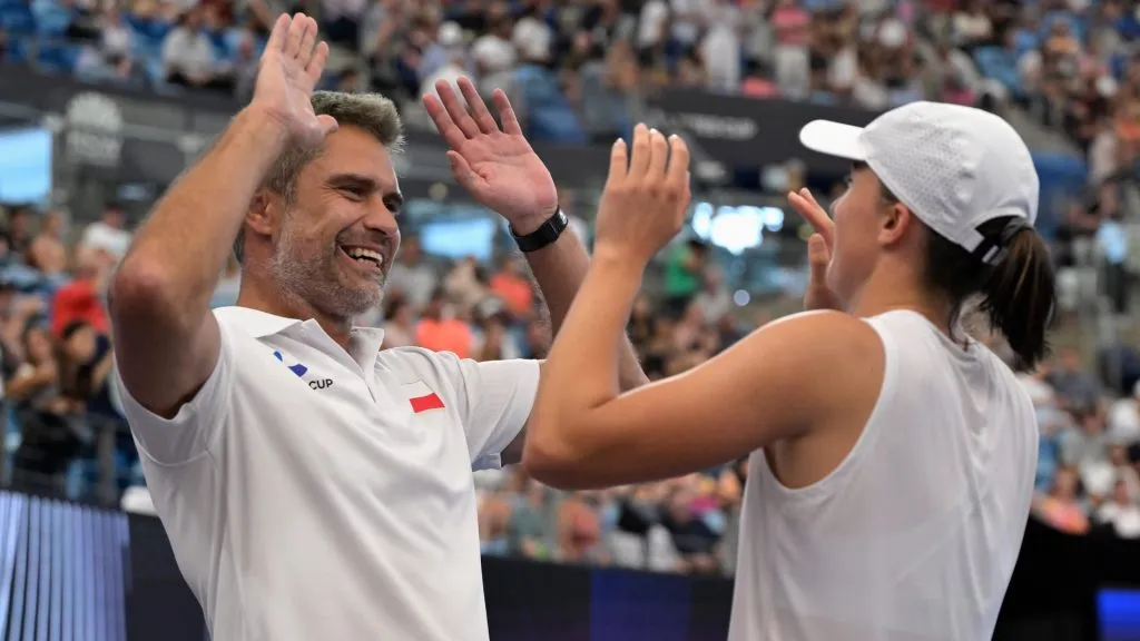 Iga Swiatek celebrates with Team Poland team captain Tomasz Wiktorowski after winning her final match against Angelique Kerber of Germany during the 2024 United Cup. (Brett Hemmings/Getty Images)