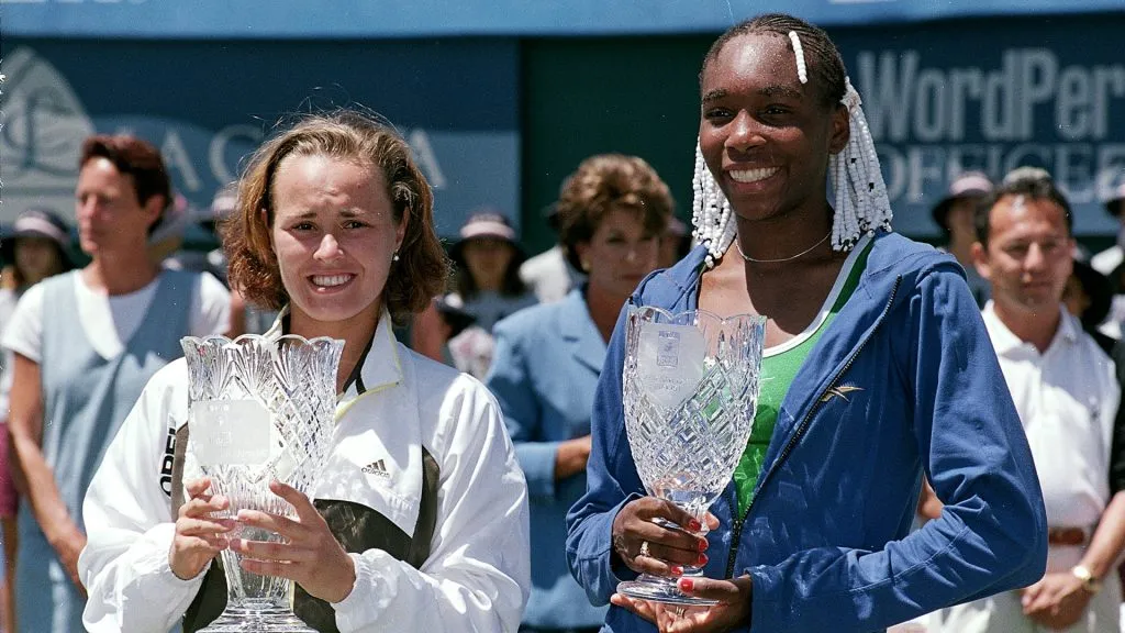 Martina Hingis holds her trophy as she poses with Venus Williams after the Women’s TIG Classic at La Costa Resort and Spa in Carlsbad. (Harry How/Allsport/Getty Images)