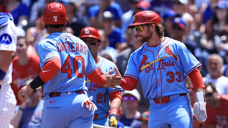 Willson Contreras #40 of the St. Louis Cardinals celebrates scoring with teammate Brendan Donovan #3.
