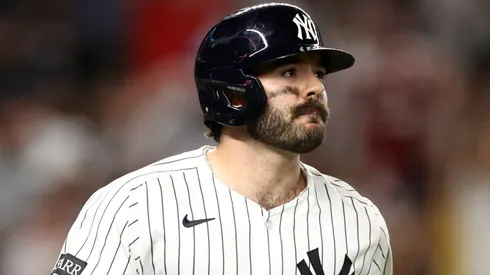 Austin Wells reacts on the field during a tense moment in the Yankees game against the Rays.