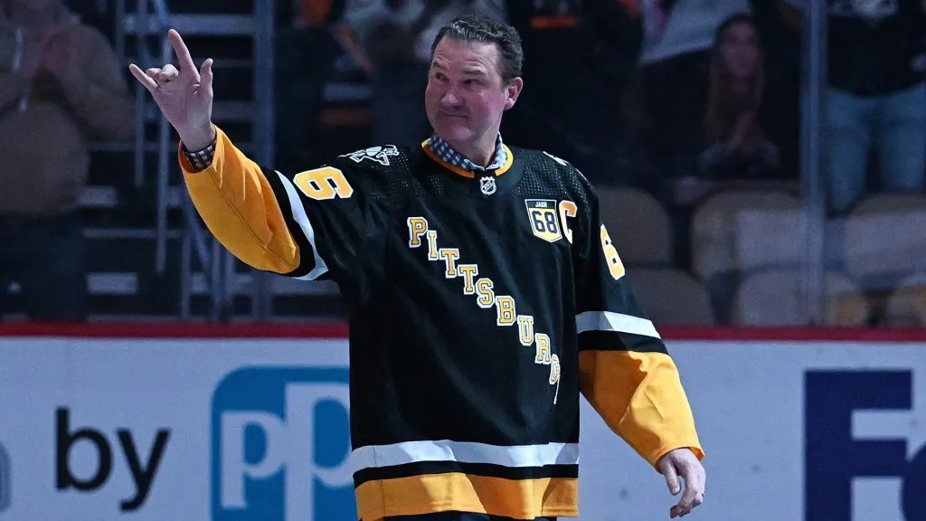 Mario Lemieux waves to the crowd as he walks onto the ice for the Jaromir Jagr jersey retirement ceremony before the game between the Pittsburgh Penguins and the Los Angeles Kings at PPG PAINTS Arena on February 18, 2024 in Pittsburgh, Pennsylvania.