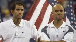 Pete Sampras and Andre Agassi stand as they receive their trophy during the 2002 US Open.