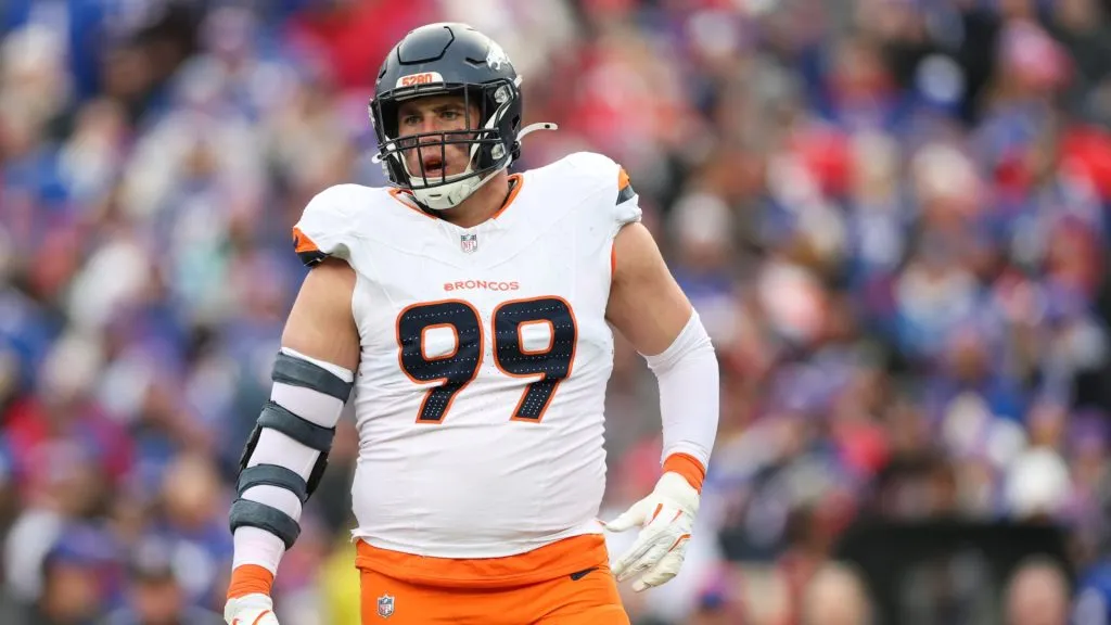 Zach Allen #99 of the Denver Broncos reacts after a sack against the Buffalo Bills during the AFC Wild Card Playoffs in Orchard Park, New York.