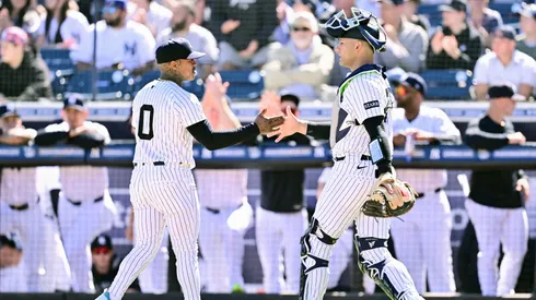 Marcus Stroman #0 and Preston Claiborne #79 of the New York Yankees celebrate in the middle of the first inning against the Tampa Bay Rays.