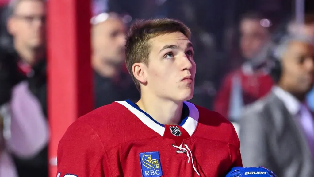 Lane Hutson #48 of the Montreal Canadiens stands during the national anthem prior to the game against the Ottawa Senators at the Bell Centre on October 12, 2024 in Montreal, Quebec, Canada.