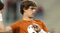 Arch Manning #16 of the Texas Longhorns warms up prior to a game against the Texas A&M Aggies at Kyle Field on November 30, 2024 in College Station, Texas.