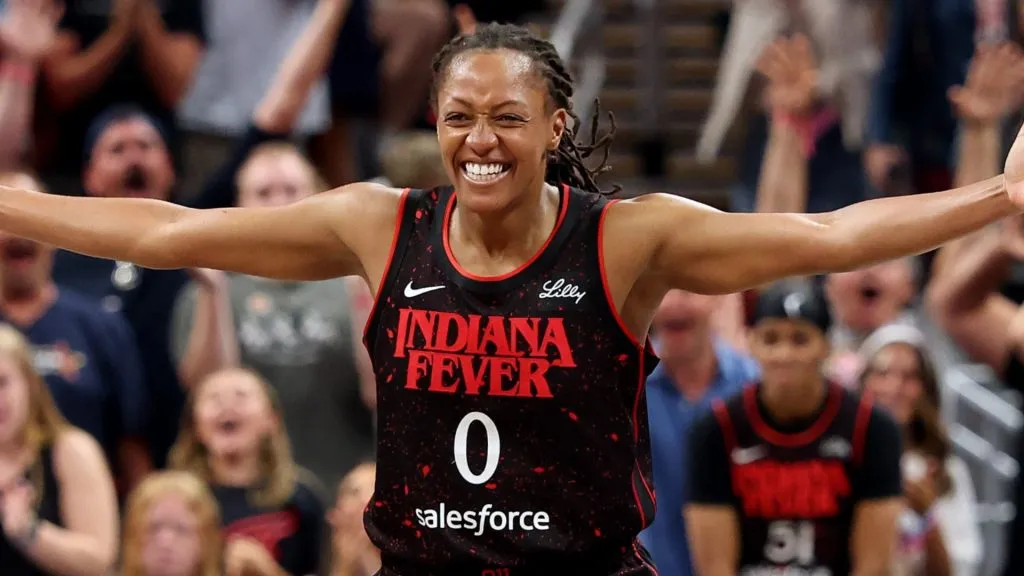 Kelsey Mitchell #0 of the Indiana Fever celebrates after Aari McDonald #2 made a three point shot in the fourth quarter during the game against the Las Vegas Aces on July 24, 2025. (Source: Andy Lyons/Getty Images)