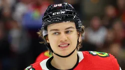 Connor Bedard #98 of the Chicago Blackhawks laughs against the Colorado Avalanche during the second period at the United Center on December 19, 2023 in Chicago, Illinois.