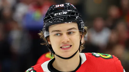 Connor Bedard #98 of the Chicago Blackhawks laughs against the Colorado Avalanche during the second period at the United Center on December 19, 2023 in Chicago, Illinois.