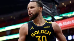 Stephen Curry #30 of the Golden State Warriors reacts against the Houston Rockets after making a shot during the fourth quarter in Game Seven of the Western Conference First Round NBA Playoffs.