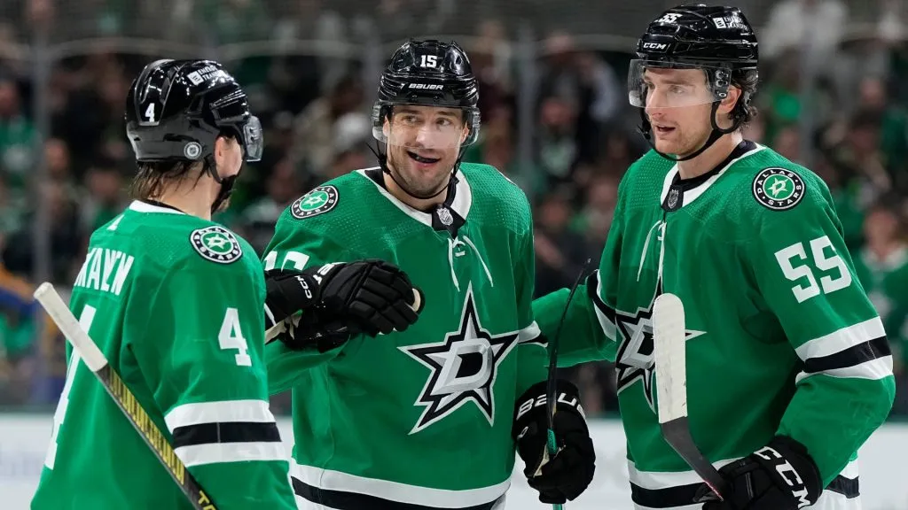 Craig Smith #15 of the Dallas Stars is congratulated by Miro Heiskanen #4 and Thomas Harley #55 after scoring Smith scored a goal during the first period against the Los Angeles Kings at American Airlines Center on March 16, 2024 in Dallas, Texas. (Photo by Sam Hodde/Getty Images)