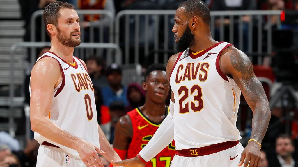 LeBron James #23 of the Cleveland Cavaliers reacts with Kevin Love #0 after drawing a foul against the Atlanta Hawks. (Kevin C. Cox/Getty Images)