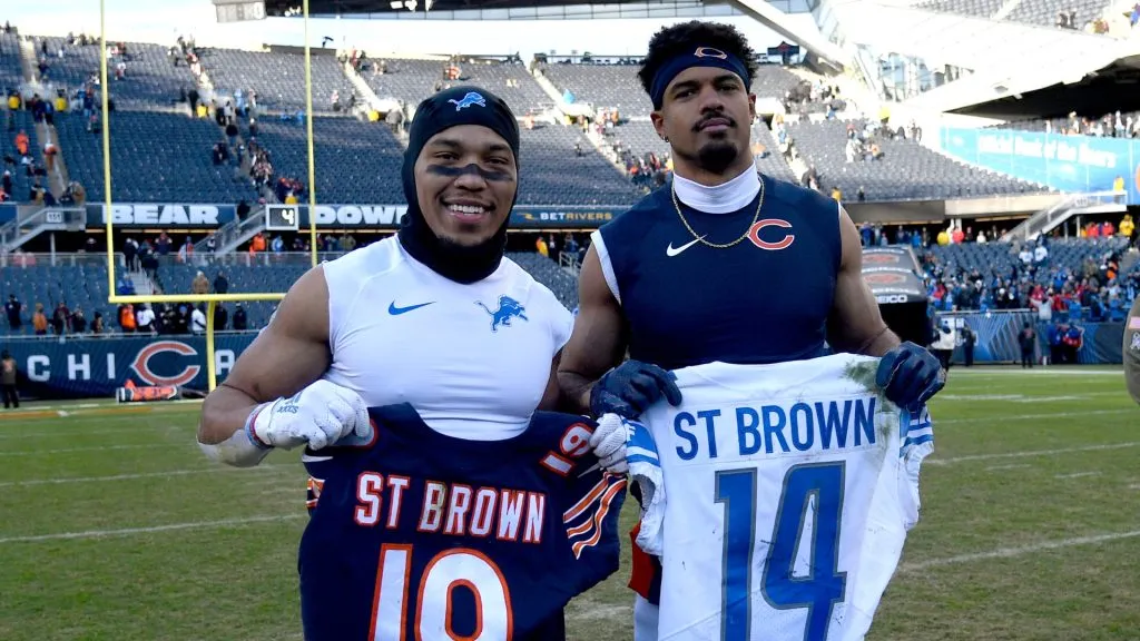 Amon-Ra St. Brown #14 of the Detroit Lions and Equanimeous St. Brown #19 of the Chicago Bears pose with each others jerseys after Detroit’s 31-30 win at Soldier Field on November 13, 2022 in Chicago, Illinois.