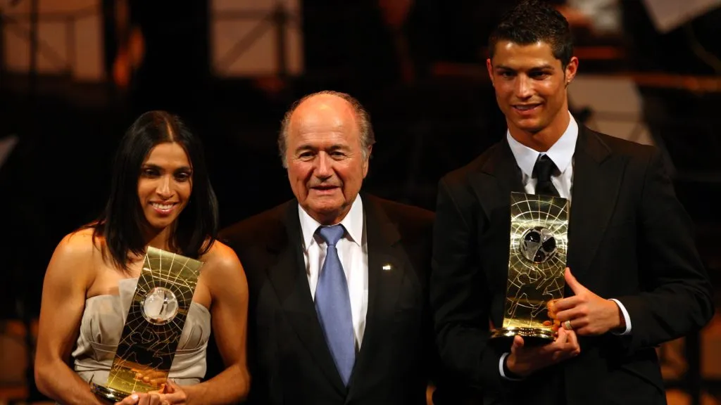 FIFA President Sepp Blatter (C) poses with Marta of Brazil and Cristiano Ronaldo of Portugal after they won The FIFA World Players of the Year 2008. (John Gichigi/Getty Images)
