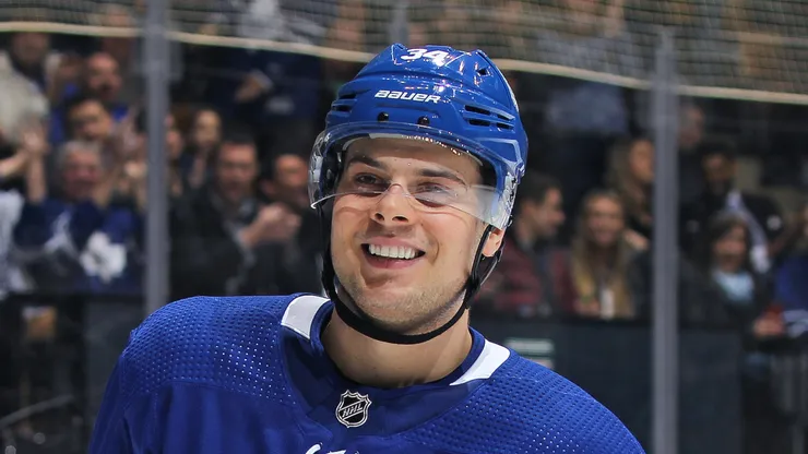 Auston Matthews #34 of the Toronto Maple Leafs seems very pleased after setting up teammate William Nylander #29 for a goal against the Buffalo Sabres during an NHL game at the Air Canada Centre on April 2, 2018 in Toronto, Ontario, Canada.