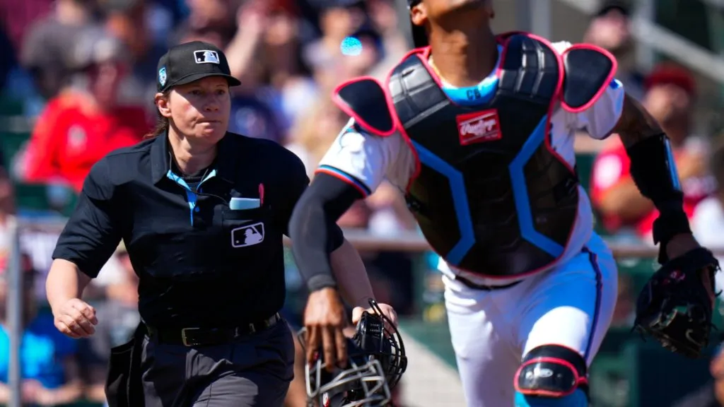 Umpire Jen Pawol looks on as Christian Bethancourt attempts to catch a fly ball against the Washington Nationals during the first inning of. spring training game in 2024. (Source: Rich Storry/Getty Images)