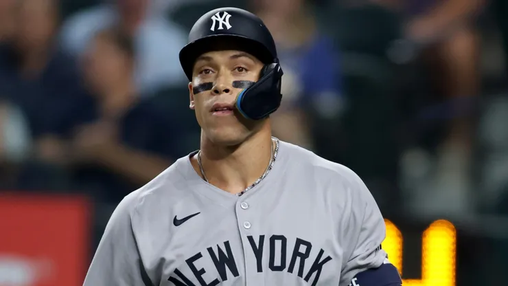 Aaron Judge #99 of the New York Yankees walks back to the dugout after striking out.