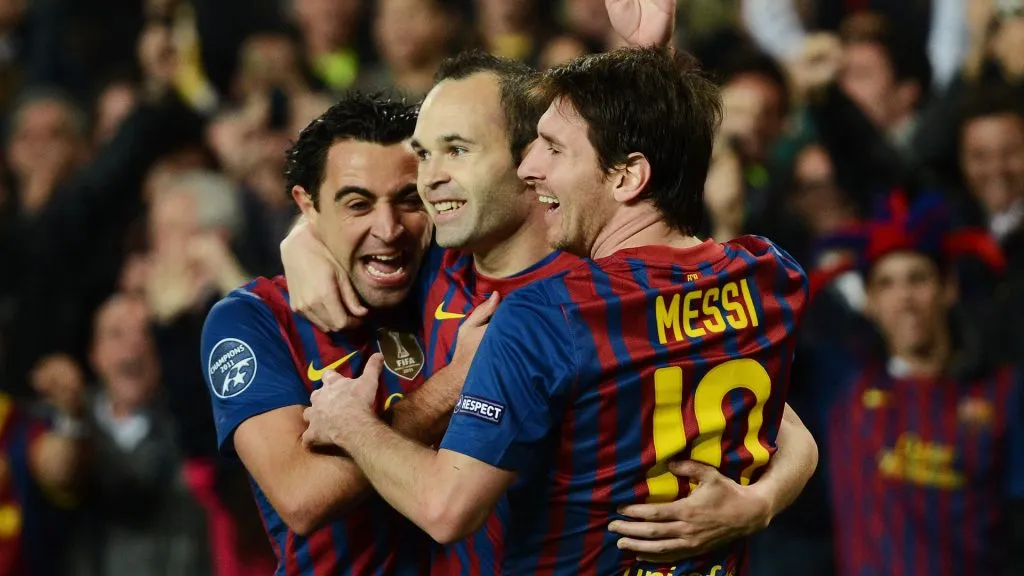 Andres Iniesta (C) of FC Barcelona celebrates scoring with his teammates Lionel Messi (R) and Xavi Hernandez during a Champions League game. (Jasper Juinen/Getty Images)