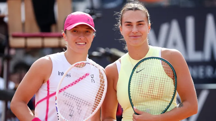 Iga Swiatek of Poland and Aryna Sabalenka pose at the net before their Women's Singles Final Match during Day 13 of the Internazionali BNL D'Italia 2024.