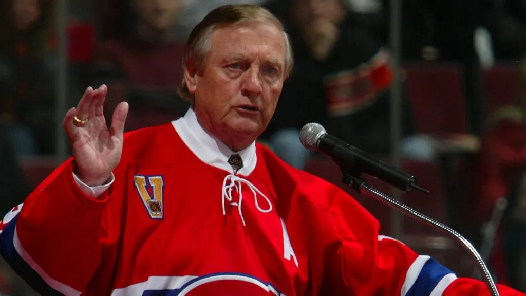 Dickie Moore addresses fans during a pre-game ceremony to retire both his and Yvan Cournoyer’s #12 jersey before the Canadiens game against the Toronto Maple Leafs in 2005. (Source: Charles Laberge/Getty Images)