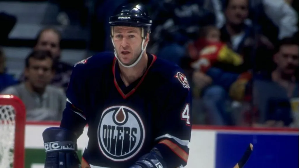 Kevin Lowe #4 of the Edmonton Oilers in action during a game against the Calgary Flames at the Canadien Airlines Saddledome in 1997. (Source: Ian Tomlinson /Allsport)