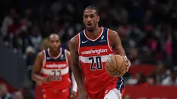 Alex Sarr #20 of the Washington Wizards handles the ball against the Orlando Magic.