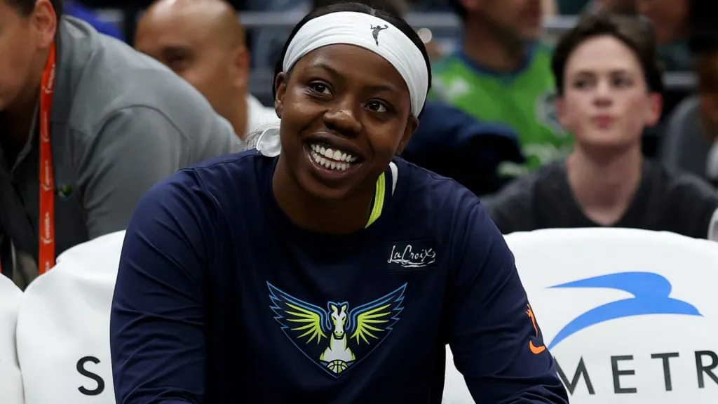 Arike Ogunbowale #24 of the Dallas Wings sits on the bench before the game against the Seattle Storm at Climate Pledge Arena on July 22, 2025. (Source: Steph Chambers/Getty Images)