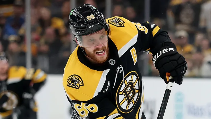 David Pastrnak skates during a Boston Bruins game as contract controversy surrounds the team.
