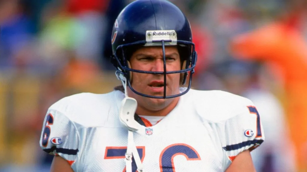 Steve McMichael #76 of the Chicago Bears walks across the field during the game against the Green Bay Packers on October 31,1993. (Source: Jonathan Daniel/Getty Images)