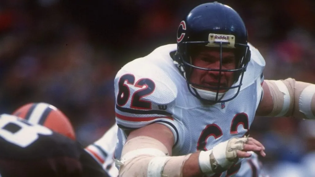 Offensive lineman Mark Bortz of the Chicago Bears runs with the ball during a game against the Cleveland Browns at Soldier Field in 1992. (Source: Getty Images)