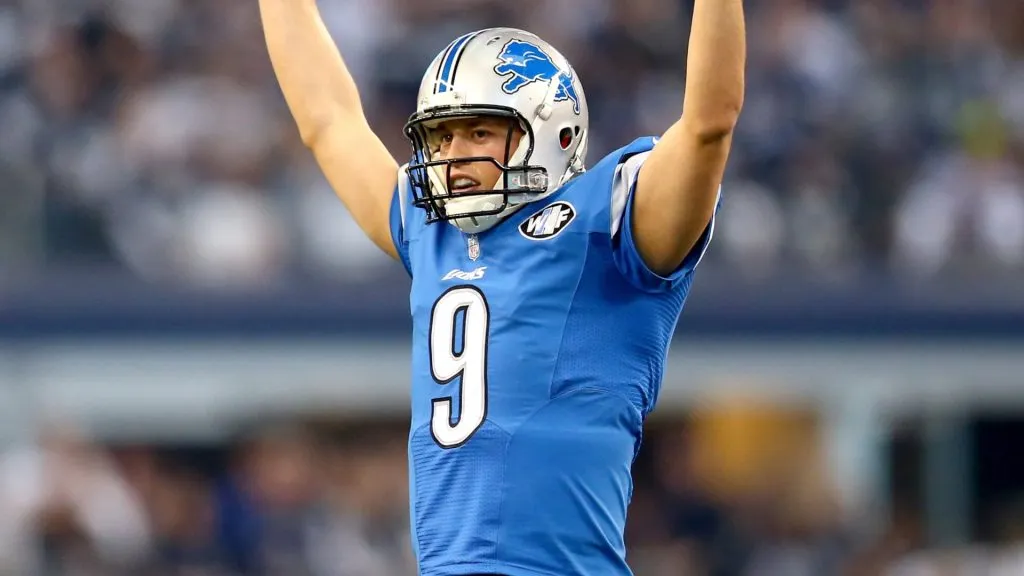 Matthew Stafford celebrates the 18-yard rushing touchdown by running back Reggie Bush in the first quarter against the Cowboys during the NFC Wildcard Playoff Game in 2015. (Source: Ronald Martinez/Getty Images)