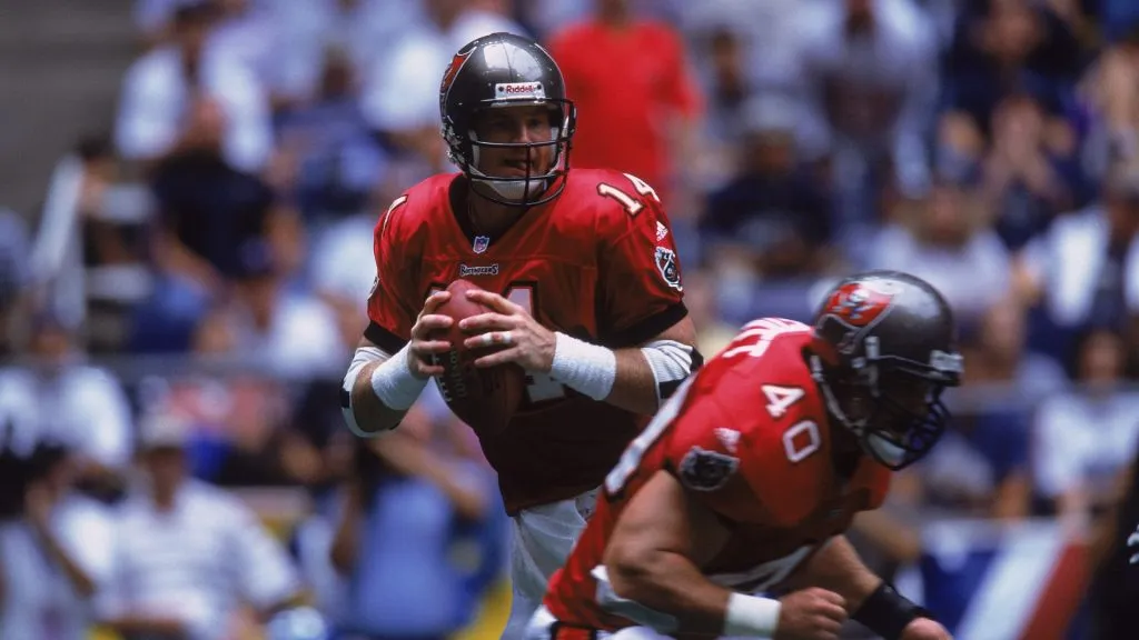 Quarterback Brad Johnson #14 of the Tampa Bay Buccaneers looking for someone down field to throw the ball to with Mike Alstott #40 blocking for him game in 2001. (Source: Ronald Martinez /Allsport)