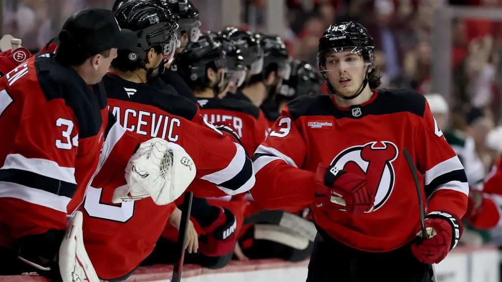 Luke Hughes #43 of the New Jersey Devils celebrates his goal with teammates on the b ench during the first period against the Minnesota Wild at Prudential Center on March 31, 2025 in Newark, New Jersey. (Photo by Elsa/Getty Images)