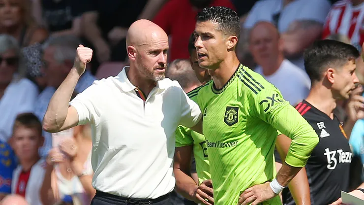 Erik ten Hag speaks to Cristiano Ronaldo of Manchester United after they received medical treatment during the Premier League match between Southampton FC and Manchester United.