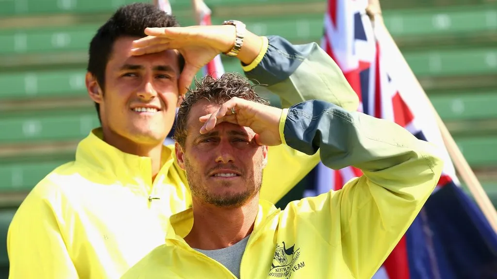 Bernard Tomic and Llewton Hewitt of Australia look on during the official draw ahead of the Davis Cup Tie between Australia and the United States. (Robert Prezioso/Getty Images)